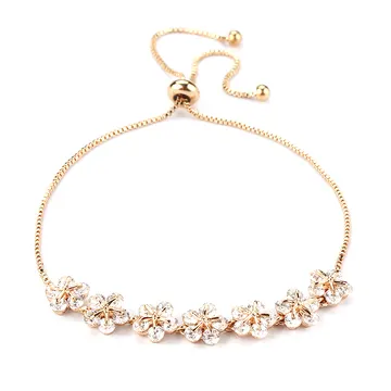 Bracelet ton doré à bouquet floral