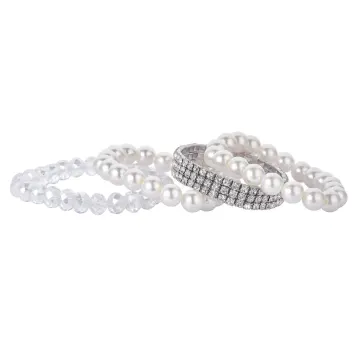 Superposition de bracelets extensibles à détails effet perle et cristaux